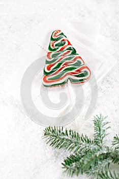 Christmas tree lolly on a festive Christmas snow background