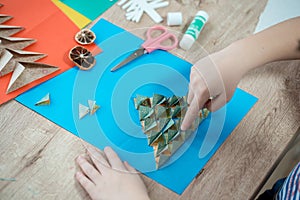 Christmas tree made of colored paper. A gift with your own hands