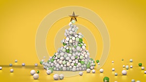 Christmas tree made of globes and star on yellow background