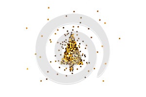 Christmas tree made of gold star shaped sequins. White background.