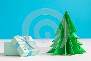 Christmas tree made of paper and gift box minimal creative winter concept