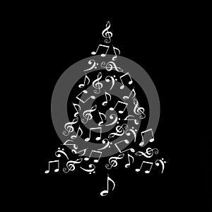 Christmas tree made of shiny silver musical notes on black