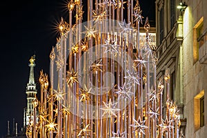 Christmas tree and the Madonnina in Milan by night