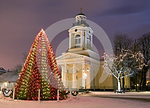 Christmas tree near church at new year eve