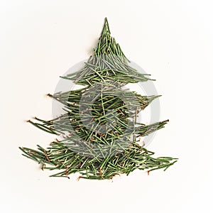 Christmas tree needles on the white Background. Pine tree branches. New Year Concept.