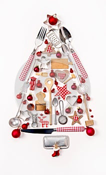 Christmas tree of old and antique miniatures in red, silver and