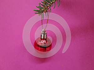 Christmas tree ornament on a pink background