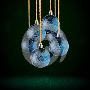 Christmas tree ornaments hanging. Balls made of glass or plastic hanging over abstract background