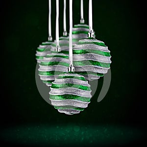 Christmas tree ornaments hanging. Balls made of glass or plastic hanging over abstract background