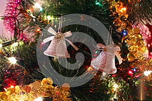 Christmas tree ornaments, two bells, tinsel