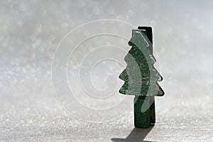 Christmas tree peg standing on glitter