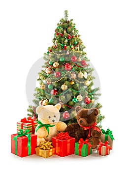 Christmas tree, pile of Christmas gifts, two teddy bears isolated on white background