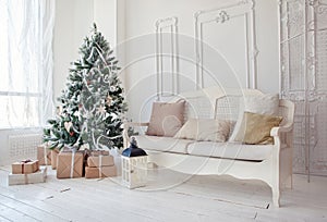 Christmas tree with presents underneath in living room