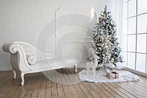 Christmas tree with presents underneath in living room