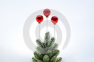 Christmas tree with red baubles ornament set as ballon on top