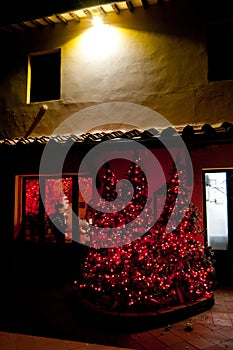 Christmas tree with red lights at Tuscan farm