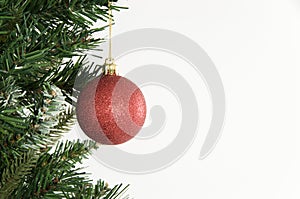 Christmas tree and red ornament on white background