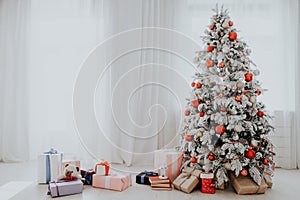 Christmas tree in a room with toys and gifts holiday new year winter postcard
