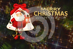 Christmas tree with santa toy and Merry Christmas and Happy New Year text on blured background