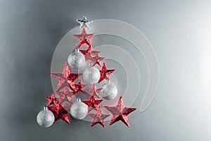 Christmas tree shape with red stars and silver baubles