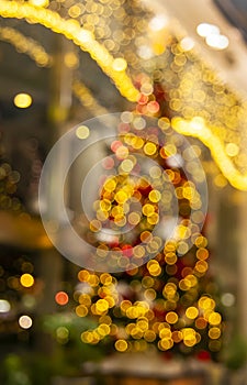 christmas tree in shopping mall out of focus, xmas bokeh lights