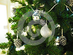 A Christmas tree with silver ornaments is a festive sight.