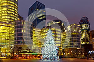 Christmas tree among the skyscrapers in Paris, France.