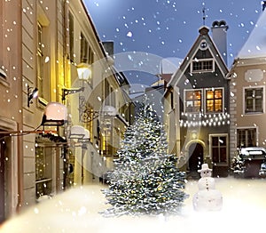 Christmas tree and snow man  moon on night sky  illuminated snow flakes festive  bokeh light  snowman on Town hall square