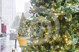 Christmas tree with snow on the streets of new york.