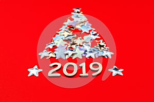 Christmas tree of stars on red background