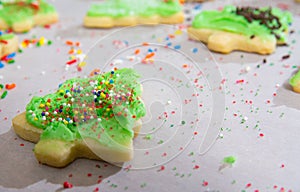 Christmas Tree Sugar Cookings being decorated