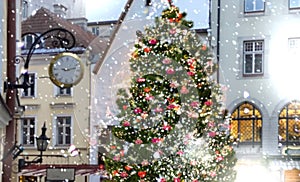 Christmas tree in Tallinn ,decoration on street in medieval city  houses in snowy  old town holiday in Estonia