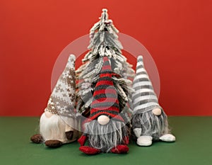 christmas tree and three gnomes gonk on red background