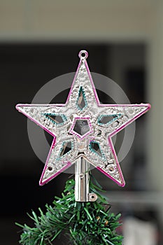 A Christmas tree top tip star topper decoration piece