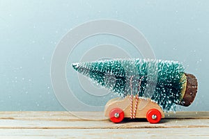 Christmas tree on toy car. Christmas holiday celebration concept