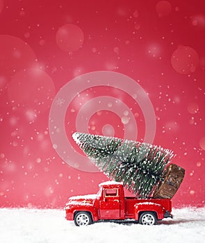 Christmas tree on toy car. Christmas holiday concept.