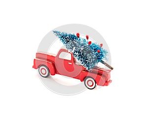 Christmas tree on toy pickup truck. Christmas holiday celebration concept