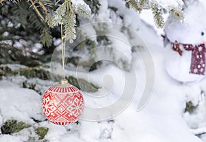 christmas tree toy on a snowy tree