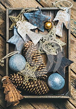 Christmas tree toy stars, balls and garland in wooden box