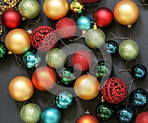 Christmas tree toys balls on dark background.