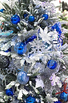 Christmas tree toys. Christmas and New Year decor. Festive background in blue and silver colors