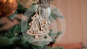 Christmas tree with toys and decorative snow for a happy new year on background of bokee