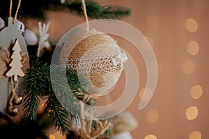 Christmas tree with toys and decorative snow for a happy new year on background of bokee