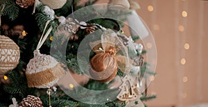 Christmas tree with toys and decorative snow for a happy new year on background of bokee