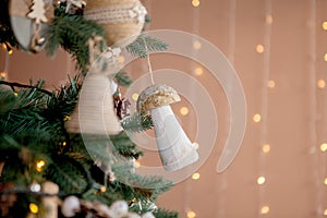 Christmas tree with toys and decorative snow for a happy new year on background of bokee