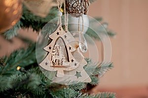 Christmas tree with toys and decorative snow for a happy new year on background of bokee