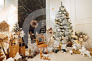 Christmas Tree with toys and gifts. Christmas decor in a special living room with fireplace