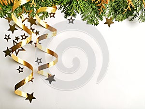 Christmas tree toys, golden stars and fir branch on a white background. Christmas decorations. Greetings card.