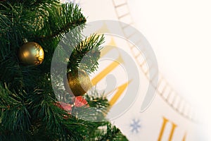 Christmas tree traditional decorated by sparkled ball sphere, clock time background concept with white color copy space here