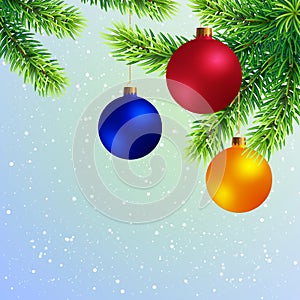 Christmas Tree Twigs with Colored Balls on Snowy Background